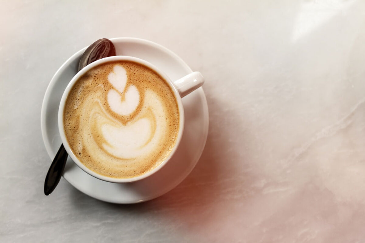 tasty-classic-traditional-italian-coffee-cappuccino-on-table-in-cafe-day-light-top-view-with-copy-space-web