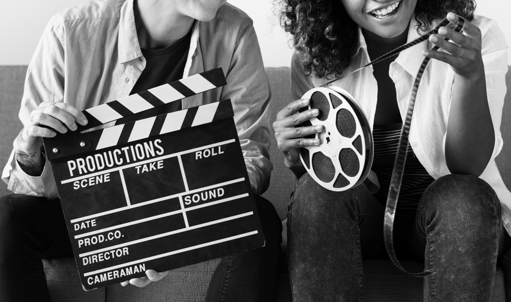 young-women-with-movie-film-reelweb