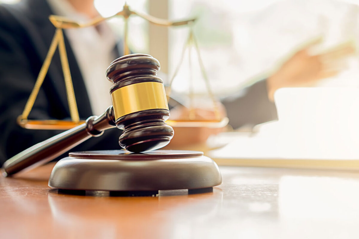 judge-gavel-with-justice-lawyers-having-team-meeting-at-law-firm-background-web