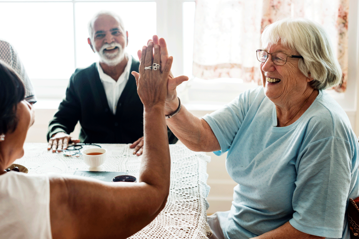 senior-women-giving-each-other-high-five-web