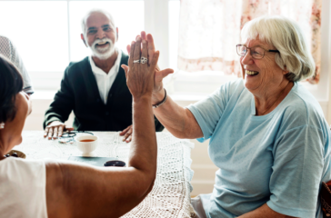 senior-women-giving-each-other-high-five-web