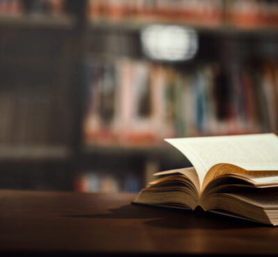 Book in library with open textbook,education learning concept