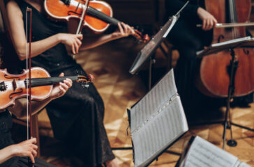 Elegant string quartet playing in luxury room at wedding recepti