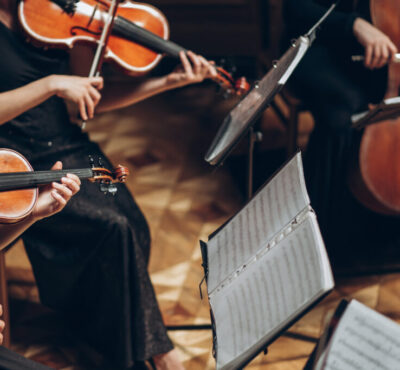 Elegant string quartet playing in luxury room at wedding recepti