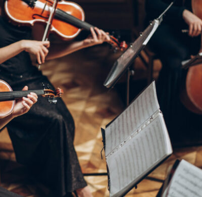 Elegant string quartet playing in luxury room at wedding recepti