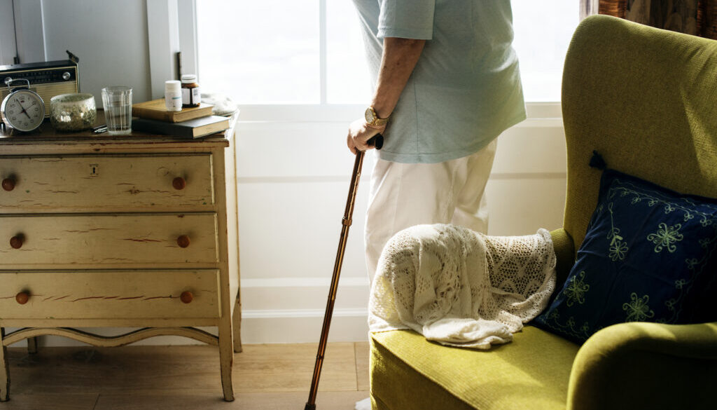 Senior woman standing alone in the room