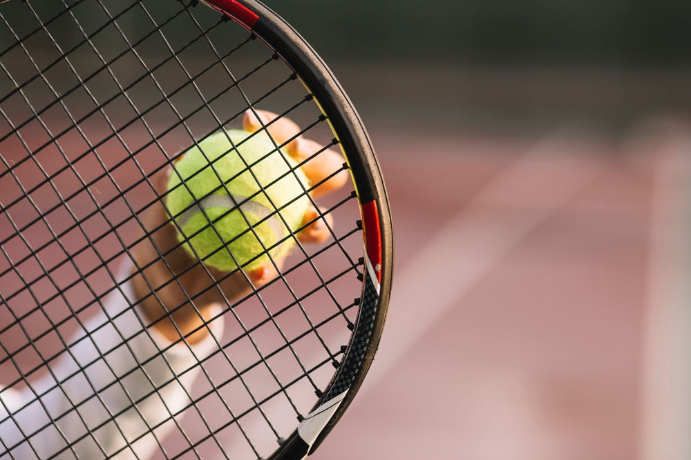 athlete-holding-racket-ball