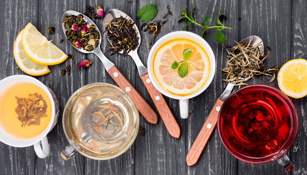 cup-with-tea-herbs-beside