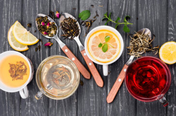 cup-with-tea-herbs-beside