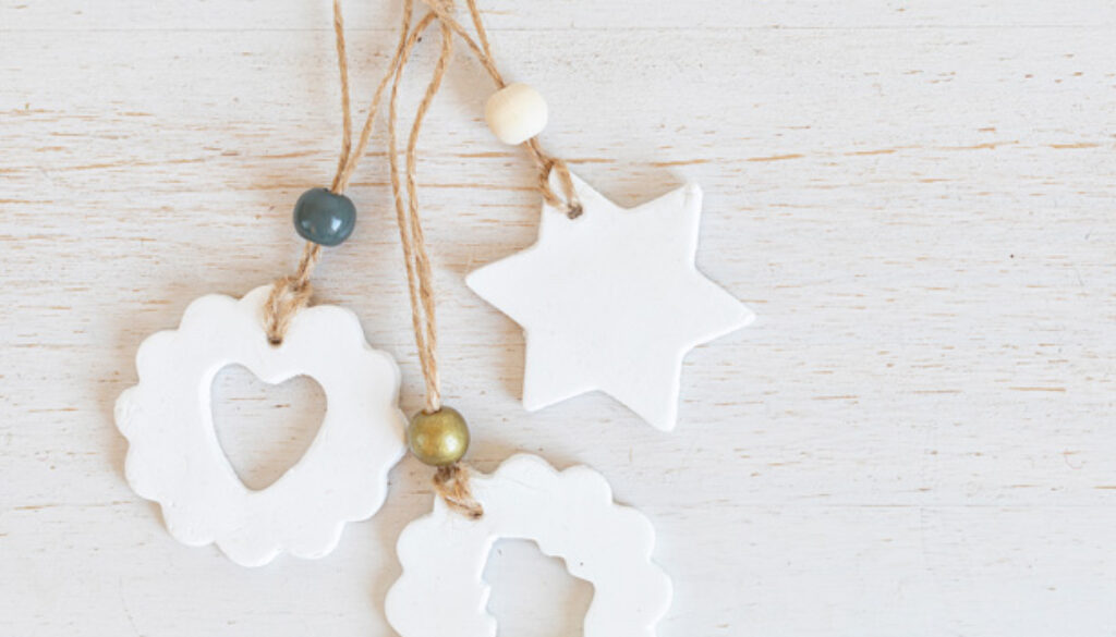 Top view of handmade christmas ornaments made of air dry clay. Xmas crafts, hobby, diy concept