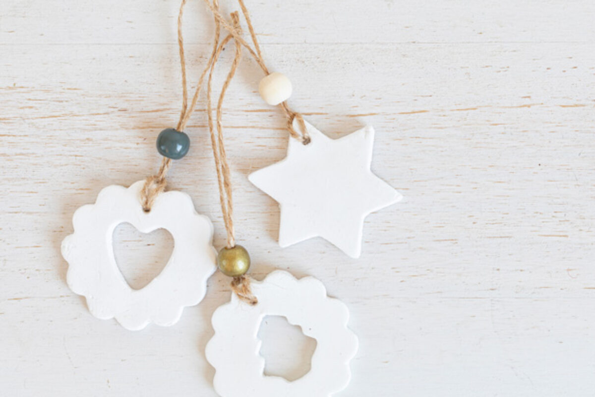 Top view of handmade christmas ornaments made of air dry clay. Xmas crafts, hobby, diy concept