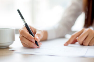 hand-businesswoman-writing-paper-office_