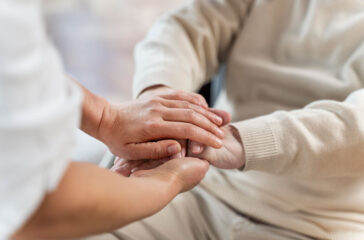 doctor-holding-hands-with-senior-patient-3